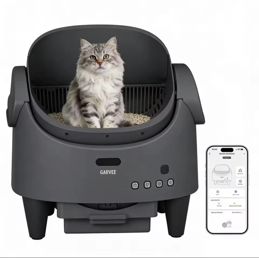 Cat sitting in a self-cleaning litter box with a smartphone app displayed on a white background