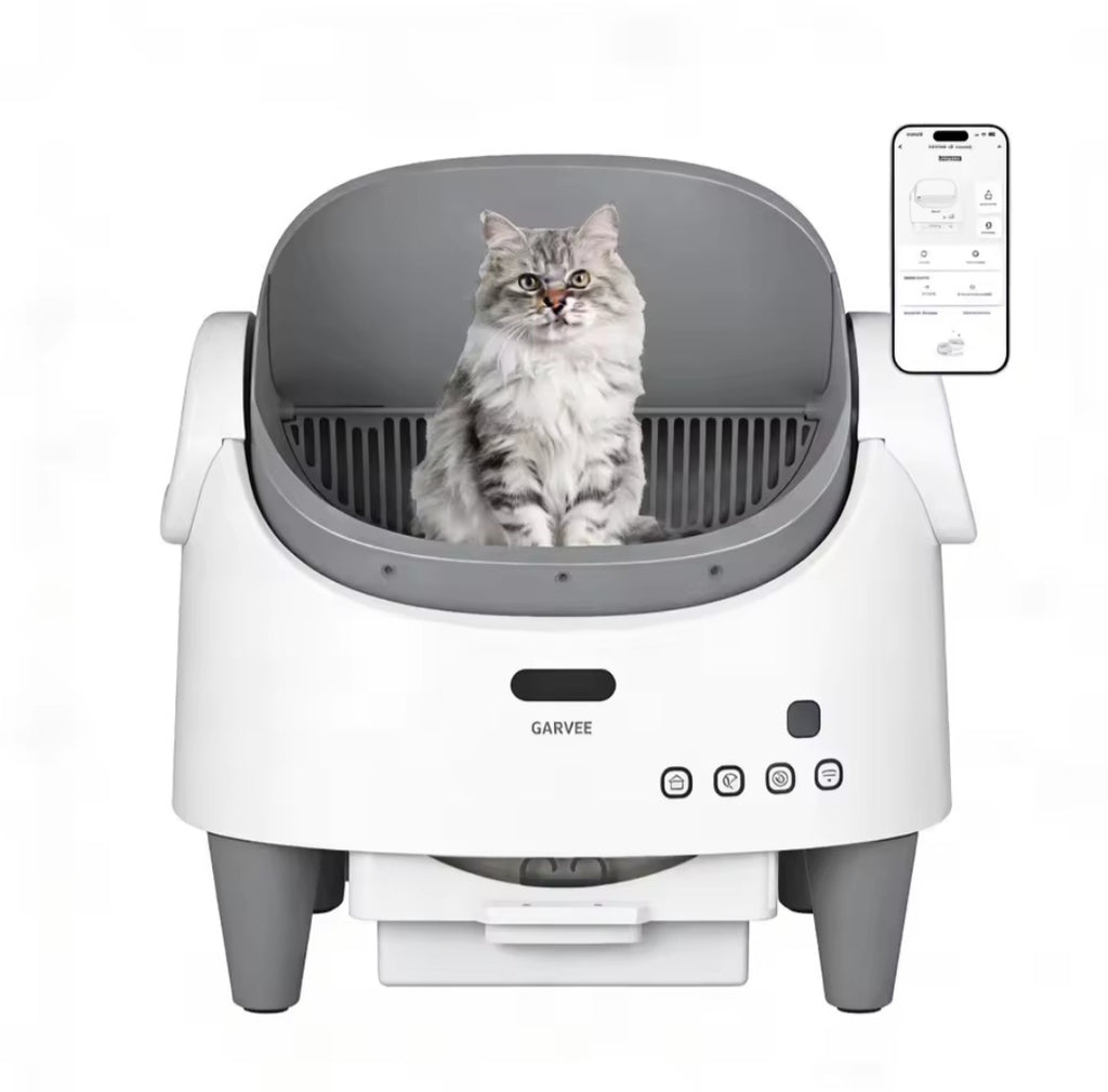 Cat sitting inside a modern pet washing machine with a smartphone app on a white background