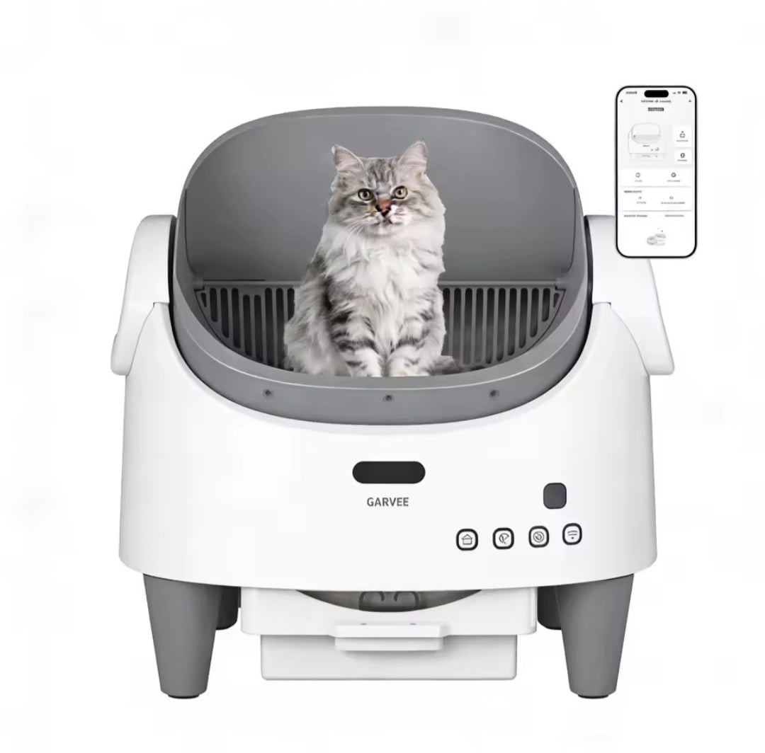 Cat sitting inside a modern pet washing machine with a smartphone app on a white background