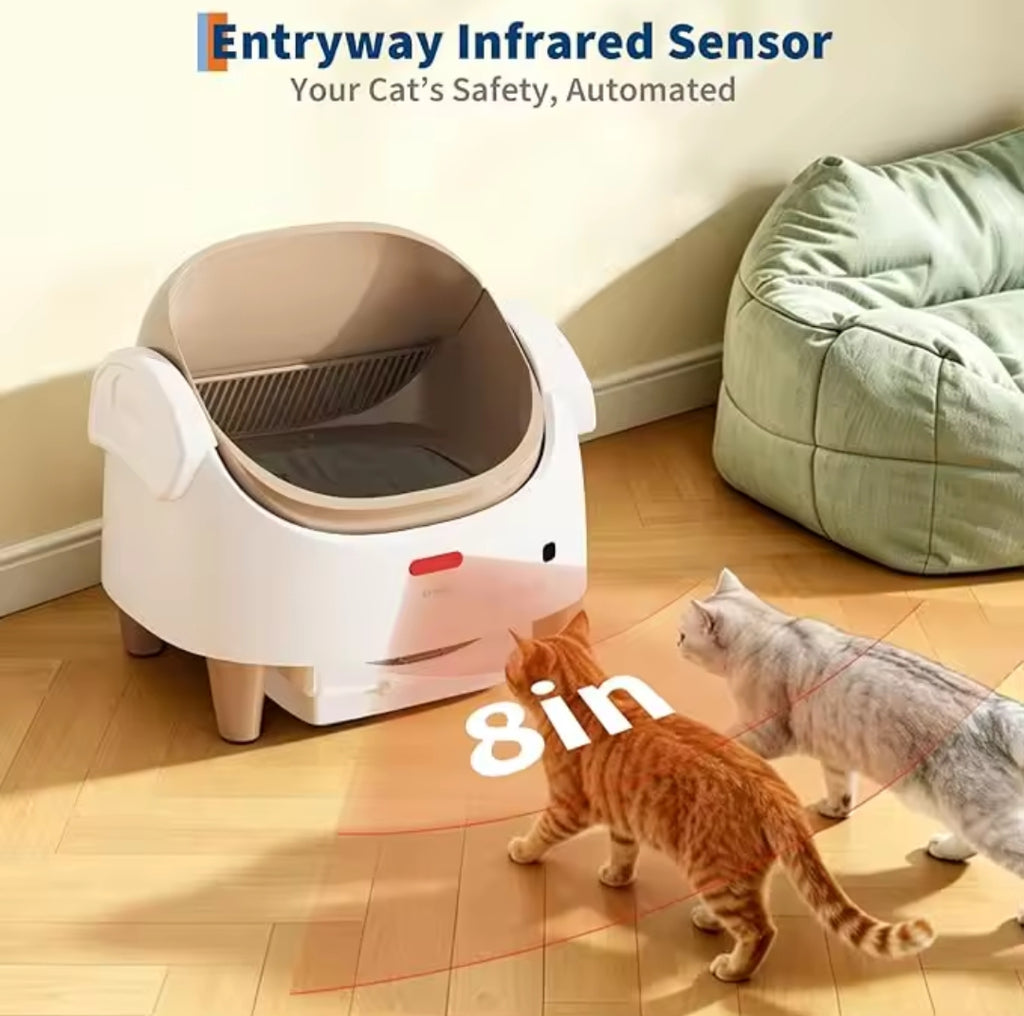 Cat litter box with entryway infrared sensor in a room with two cats approaching.